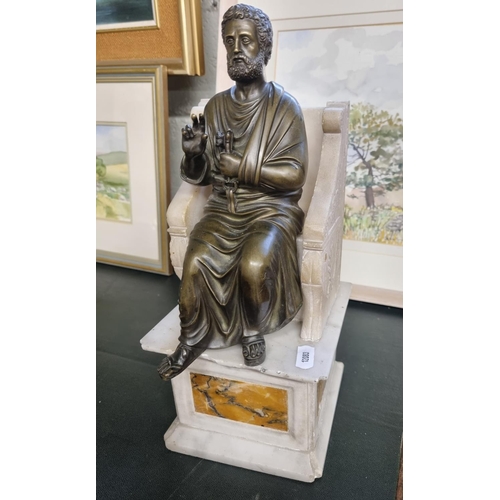 144 - A 19th Century Bronze figure of a Scribe sitting on a marble seat. H 33 cm approx.