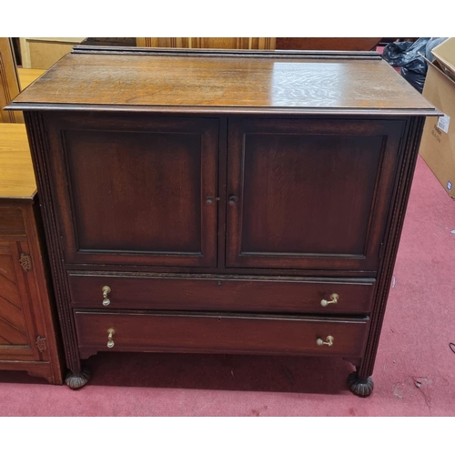 698 - An early 20th Century Oak Bureau Bookcase along with an early 20th Century Old Charm style side Cabi... 