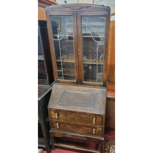 698 - An early 20th Century Oak Bureau Bookcase along with an early 20th Century Old Charm style side Cabi... 