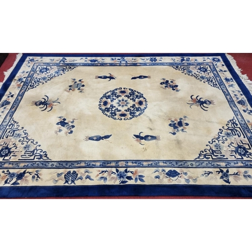 701 - A very large blue and cream ground Oriental Carpet with Greek key style detail. 370 x 280 cm approx.