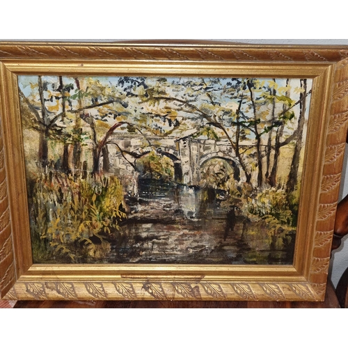 762 - An Oil on Canvas of a Bridge in a wooded setting.