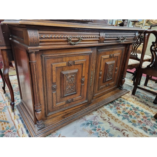 106 - An early to mid 19th Century Walnut two door Cabinet with highly carved front. W 140 x D 55 x H 252 ... 