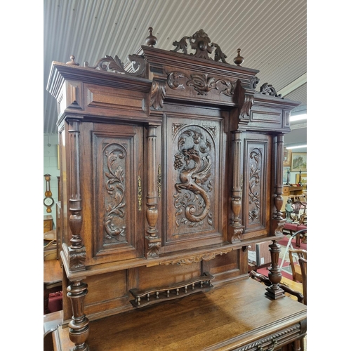 106 - An early to mid 19th Century Walnut two door Cabinet with highly carved front. W 140 x D 55 x H 252 ... 