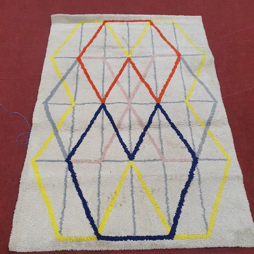 802 - A White with Coloured Geometric Design Rug.
 L 193 x W 134 cm approx.