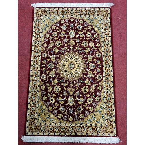 822 - A rich Red ground full pile Turkish Rug with lozenge medallion design. 164 x 100 cm approx.