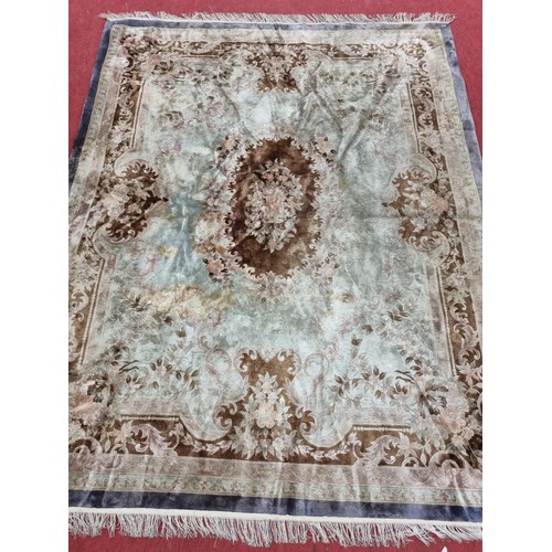 824 - A good Oriental Carpet with Cream and Purple ground. 325 x 244 cm approx.