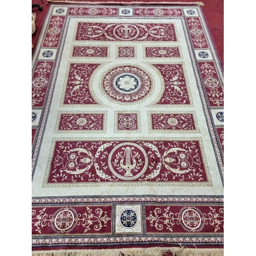 832 - Modern carpet, cream ground with red ground panels and stepped border. 
337cm x 245 cm approx.