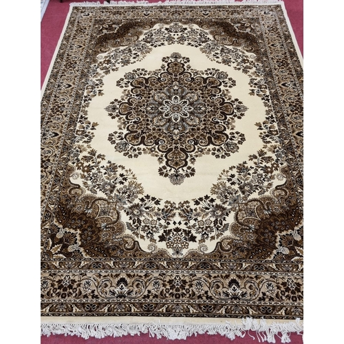 834 - A good Wool cream ground Carpet with multi borders and allover decoration. 270 x 365 cm approx.