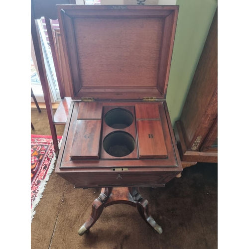 106 - A Fantastic 19th century Mahogany Teapoy, lacking bowls, on a highly shaped outline base.
H 78 x L 3... 