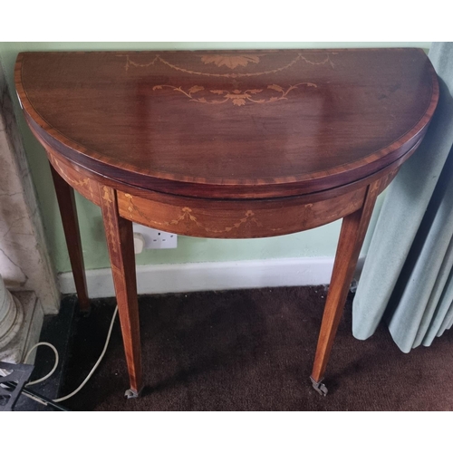 45 - An Edwardian Mahogany and Inlaid half moon bow fronted Fold over Card Table on square tapered suppor... 