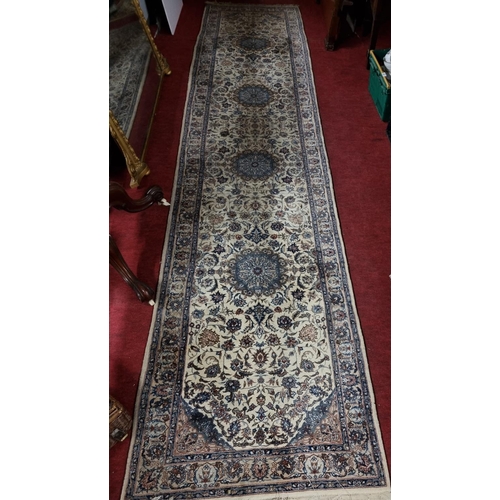 842 - A good cream ground mid pile Runner with multi borders and all over decoration. 390 x 81cm approx.
