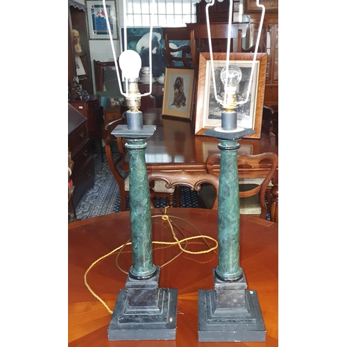 63 - A good pair of columned Lamps. H 55 cms approx.