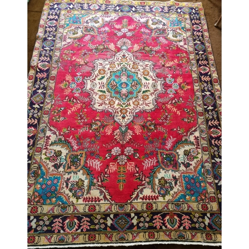 74 - A good Persian red ground Carpet with multi borders and central medallion design. 270 x 190cm approx... 