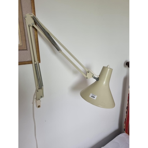 229 - A wall mounted Desk Lamp. 85 cm approx.