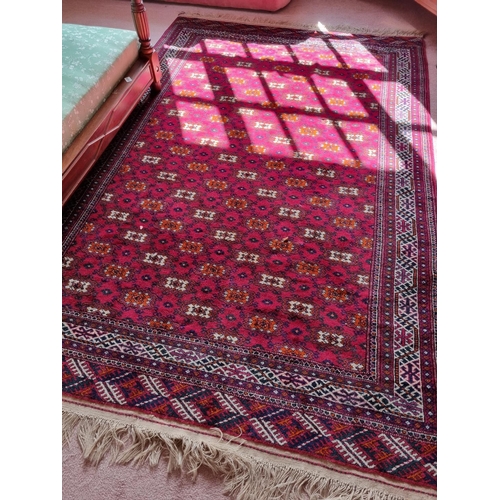 301 - A good Persian red ground Carpet with repeating medallion design and multi borders.
L 264 x W 163 m ... 