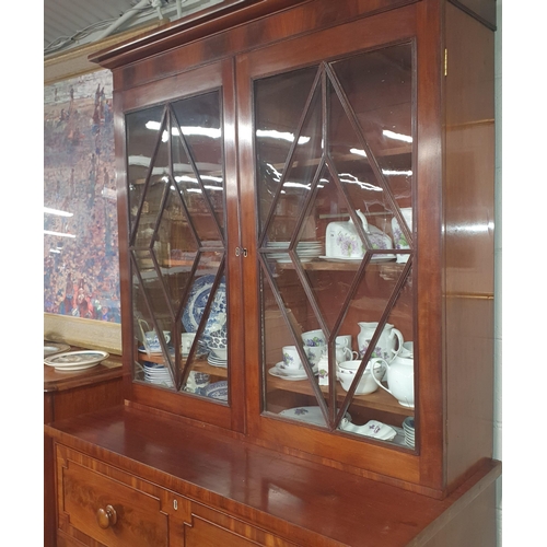 216 - A William 1Vth Figured Mahogany Secretaire Bookcase with a fully fitted interior. W 126 x D 57 x H 2... 