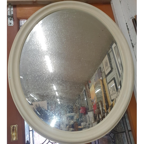 811 - Withdrawn. A large white painted oval Mirror with bevelled glass. 100 x 116 x cm approx.  ( Bartra H... 