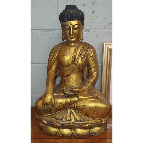 818 - A large gold coloured Buddha. W 42 x H 69 cm approx.  ( Bartra House).