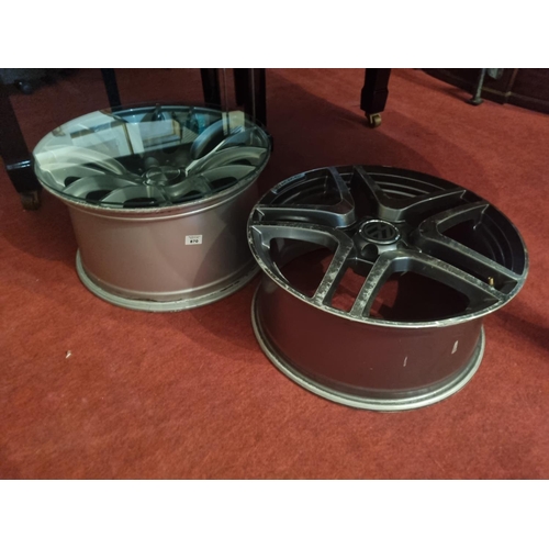 870 - Two Wheel Hubs used as coffee Tables.