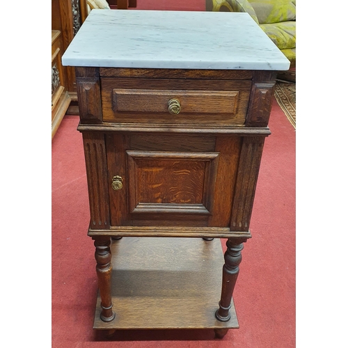 871 - A late 19th Century Oak Continental Bedside Cabinet with single door and drawer on platform base. 39... 