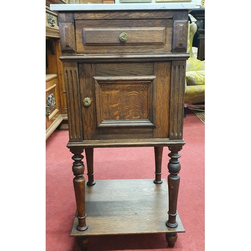 871 - A late 19th Century Oak Continental Bedside Cabinet with single door and drawer on platform base. 39... 