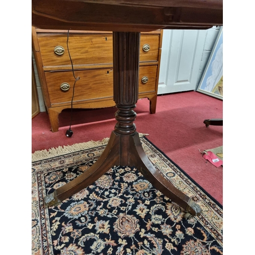 550 - A good 19th Century Mahogany two pillar Dining Table with single leaf and tripod supports with hairy... 