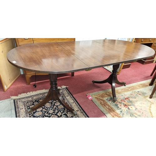 550 - A good 19th Century Mahogany two pillar Dining Table with single leaf and tripod supports with hairy... 