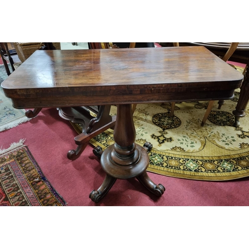 556 - A 19th Century Rosewood Foldover Card Table on turned support. 92 x 92 x H 72 cm approx.