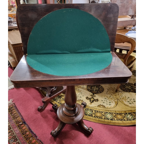 556 - A 19th Century Rosewood Foldover Card Table on turned support. 92 x 92 x H 72 cm approx.