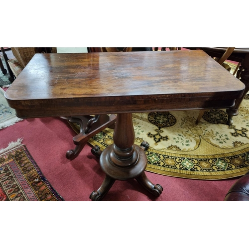 556 - A 19th Century Rosewood Foldover Card Table on turned support. 92 x 92 x H 72 cm approx.