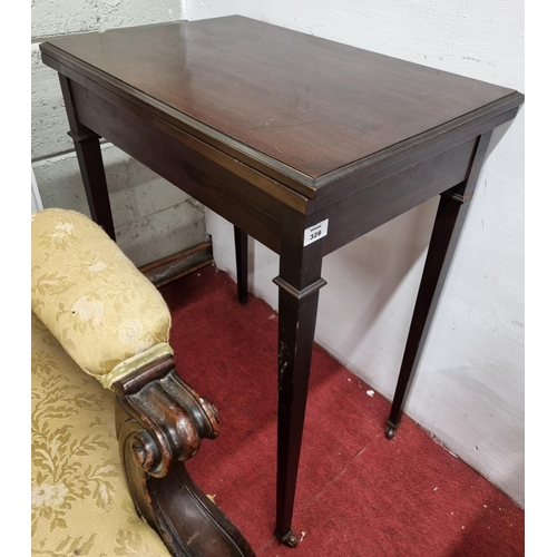 559 - An Edwardian Mahogany fold over Card Table on square tapered supports. 
H 72 x D 61 x W 80 cm approx... 