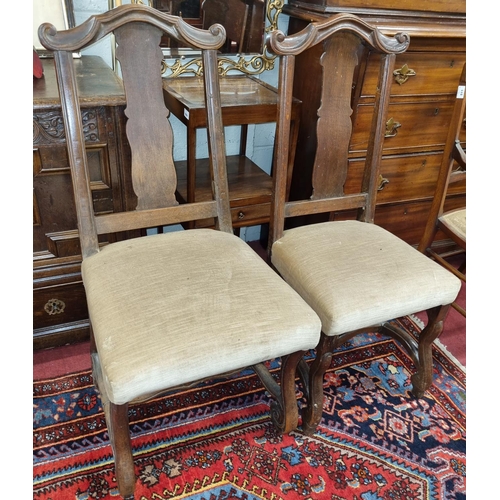 562 - A pair of 19th Century Continental Oak Hall Chairs. H 48 x D 46 x W 48 and H 44 x D 44 x W 42 cm app... 