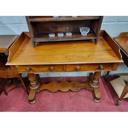 570 - A good 19th Century Mahogany Side Table with gallery back twin frieze drawer and platform base. W 10... 