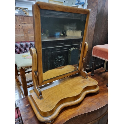 582 - A 19th Century Satin Birch crutch Mirror with serpentine fronted outline. W 55 x H 63 cm approx.