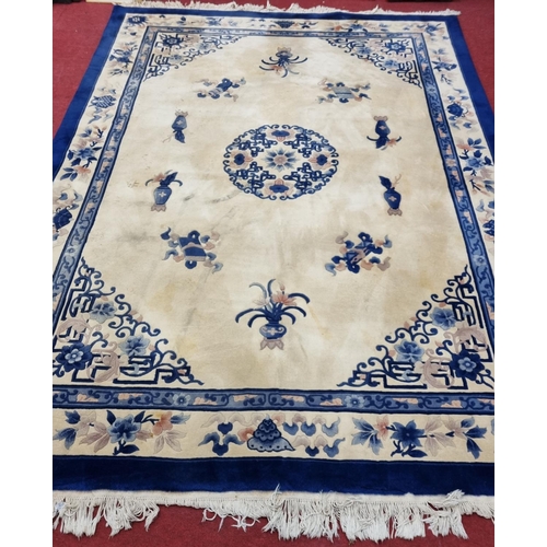 825 - A very large blue and cream ground Oriental Carpet with Greek key style detail. 370 x 280 cm approx.