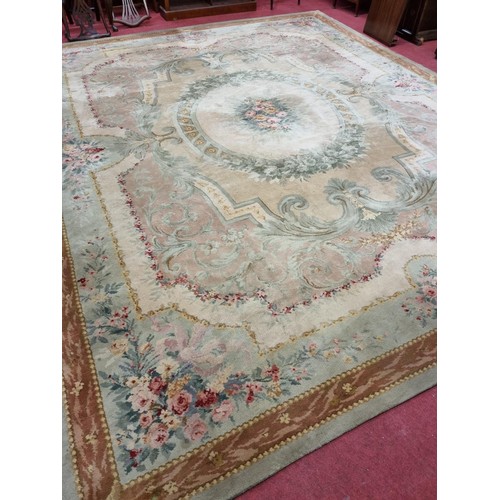 850 - A Large Aubusson style cream and green ground Carpet with central floral motif surrounded by floral ... 