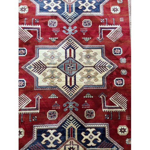 855 - Large Soft Kashmir Carpet , Red Ground with Ivory and Blue Star Design . 305 x 193 cm approx.