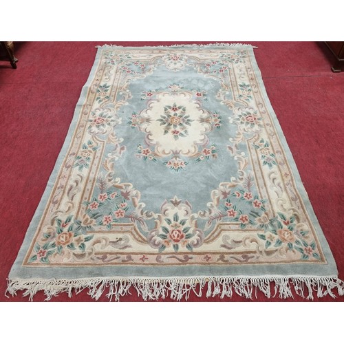 856 - Oriental style Carpet, Light Green & Cream Ground With Floral Design . 305 x 193 cm approx.