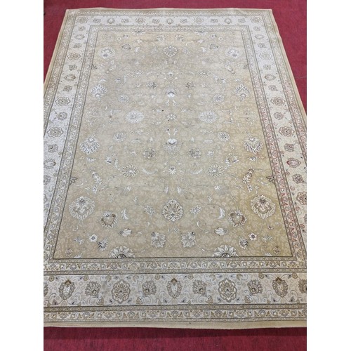830 - A large Belgium cream ground Carpet with all over decoration and multi borders. 330 x 240 cms approx... 