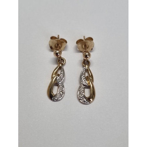 300 - A nice pair of 9ct Gold and Diamond Earrings.