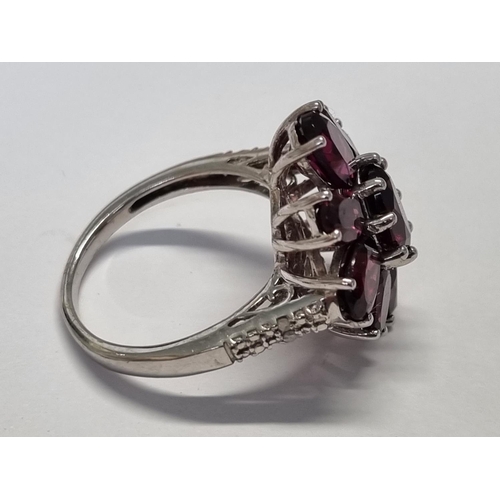 305 - A Silver and Gem set Ring, size Q.