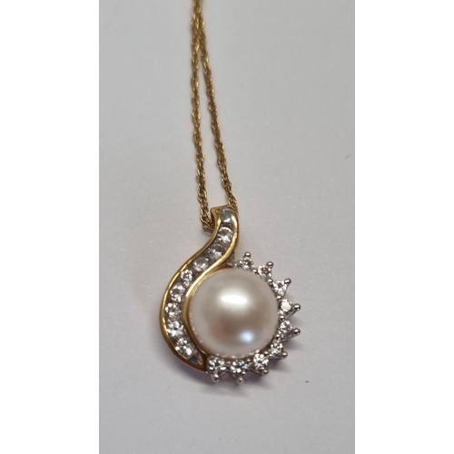 323 - A Pearl and Cubic Zircon set Pendant with Chain.