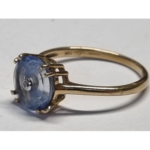 336 - An unusual Topaz and Diamond set Ring ser in 10ct Gold. Size P 1/2