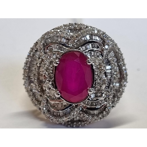 A superb 14ct Gold, Diamond and Ruby Ring, size L1/2.