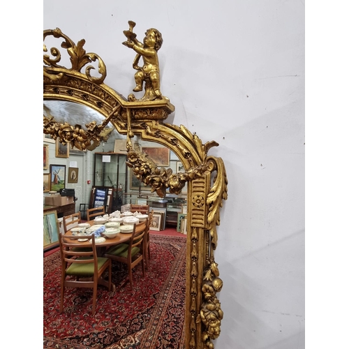 257 - A fabulous Timber and plaster Gilt overmantel Mirror with a highly molded outline, highly molded ped... 