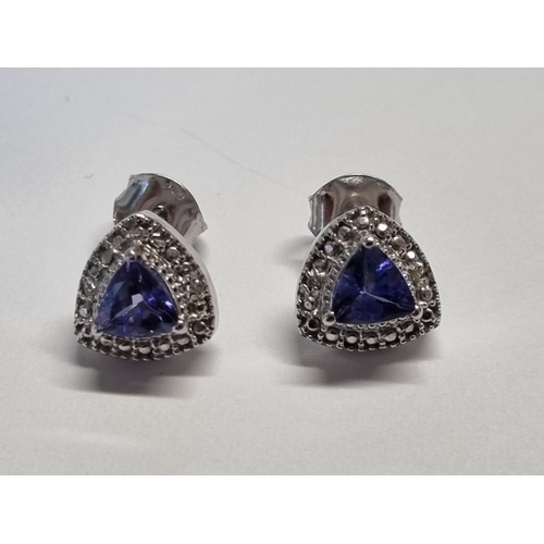 316 - Pair of tanzanite silver cluster earrings.