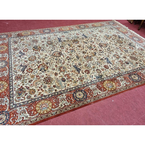 416 - A red and cream ground Carpet with multi borders and allover decoration. 250 x 357 cm approx cm appr... 