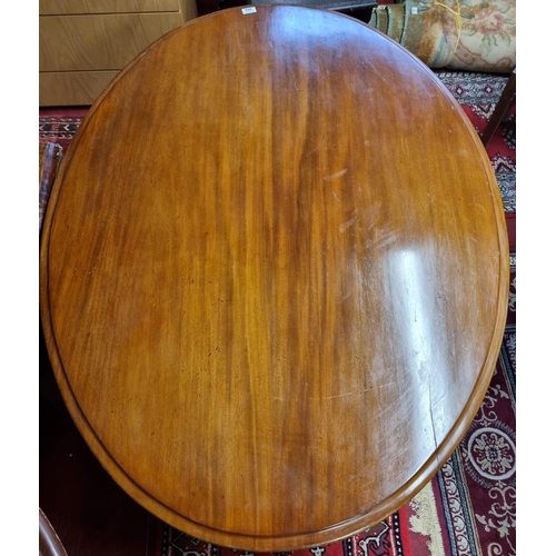 264 - A 19th Century oval supper Table with tri-pod support. H 72 x D 91 W 127 cm approx.