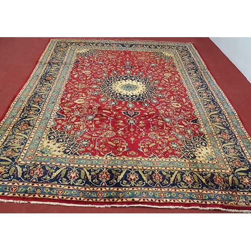 212 - A large red ground Persian Marshad Carpet with a Lozenge and medallion Shah Saffy design. 390 x 290 ... 