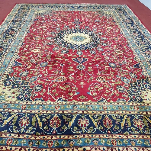 212 - A large red ground Persian Marshad Carpet with a Lozenge and medallion Shah Saffy design. 390 x 290 ... 